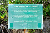 Sign for Ile aux Aigrettes Nature Reserve, explaining that all visitors must have permission to visit the island. Mauritus, July 2012.