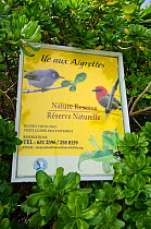 Sign for Ile aux Aigrettes, guided visits. Visitors are only allowed to visit the island with a guide and permission from the Mauritius Wildlife Foundation. Mauritus, July 2012.