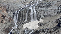 Waterfall on the Aiguille des Glaciers in spring, Val Veny Graian Alps, Italy, June.