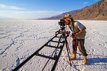 German Wildlife Cameraman, Rolf Steinmann, setting up a tracking time-lapse in Badwater Basin, Death Valley, California, May 2011 on location for Discovery North America series
