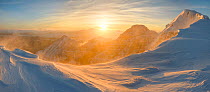 Panoramic view of sunrise on An Teallach in full winter conditions. Torridon, Highlands of Scotland, UK, January 2016.