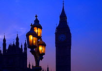 Street lighting, Houses of Parliament and Big Ben silhouetted, Westminster, London, England, UK, November.