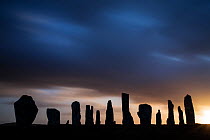 Callanish Stones silhouetted at dawn, Isle of Lewis, Outer Hebrides, Scotland, UK, April 2014.