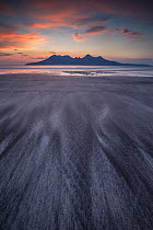 Twilight at Bay of Laig, Isle of Eigg towards Isle of Rum, Inner Hebrides, Scotland, UK, April 2014.