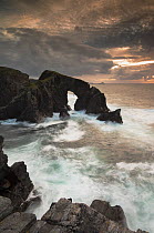 Rock archway at sunset, Isle of Lewis, Outer Hebrides, Scotland, UK, September 2014.