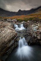 Waterfall under overcast skies, Fairy Pools, Glen Brittle, Isle of Skye, Inner Hebrides, Scotland, UK, October 2014.