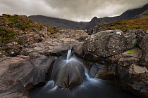 Waterfall under overcast skies, Fairy Pools, Glen Brittle, Isle of Skye, Inner Hebrides, Scotland, UK, October 2014.