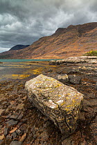 Rocky foreshore of Loch Torridon looking up to Sgorr a Chadail, Wester Ross, Scotland, November 2014.