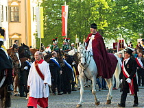 Priest  riding horse in the Blutritt (the right of blood) is the largest European procession with about 3,000 riders, Weingarten, Baden-Wurtemberg, Germany. May 2016.