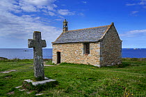 Stone cross and the Saint-Samson chapel, Landunvez, Finistere, Brittany, France, September 2015