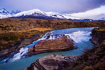 River in Torres del Paine National Park, with mountains behind, Chile, June 2015.