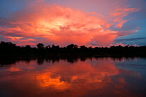 Evening thunder clouds over river near Port Jofre, Pantanal, Brazil. Taken on location for BBC Wild Brazil series.