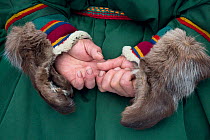 Close up of the sleeves of a Nenets man's reindeer skin Malitsa (coat) with reindeer skin mittens attached to it. Yamal, Western Siberia, Russia
