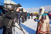 Torgina Romanova, a local Nenets TV reporter, covering the reindeer herders' festival in Nadym. Yamal, Western Siberia, Russia