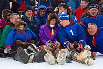 Nenets men watching a wrestling competition during the reindeer herders' festival in Nadym. Yamal, Western Siberia, Russia