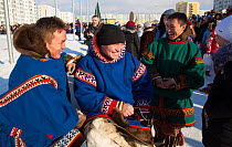 Young Nenets men in traditional clothes at the reindeer herders' festival in Nadym. Yamal, Western Siberia, Russia