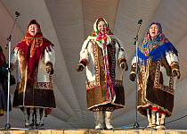 Three Mansi women (left to right) Galina Larionova, Valentina Georgimova and Tamara Kalinikova, performing traditional Mansi songs at a reindeer herders' festival in Saranpaul. Khanty-Mansiysk, Wester...