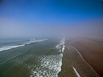 Aerial view of Hells Mouth (Porth Neigwl) with sea mist, during a warm spell, Abersoch, Wales, UK July