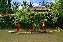 Mentawai familly on dugout canoe. Siberut. Sumatra, July 2016