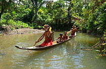 Mentawai family on dugout canoe. Siberut. Sumatra, July 2016