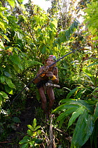 Mentawai hunter with bow and arrow, Siberut, Sumatra, July 2015