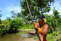 Mentawai hunter with bow and arrow, Siberut, Sumatra, July 2015