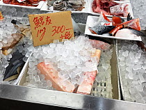 Whale skin for sale at a fish market in Japan. Cetacean species unspecified.