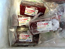 Frozen whale meat for sale, intended for consumption as sashimi