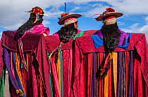 Indigenous Salasaca Indians in colourful garments, celebrating the Inti Raymi festival - or Festival of the Sun, Salasaca, Andes, Ecuador, June 2004.
