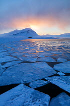 First midnight sun in late winter at Isfjorden, Svalbard, Spitsbergen, Norway, April Taken on the day of the first midnight sun of the year.