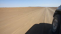 View from a car driving on a dirt road, Kaokoland, North West of Namibia. 2015.