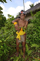 Mentawai medicine man collecting plants to make poison for arrows. Siberut Island, Sumatra. July 2016.