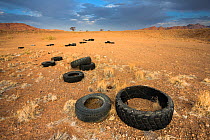 Pollution in the Namib Desert, due to illegal dumping of old tires. Namibia.