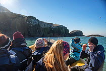 Team of RSPB volunteers approach Grassholm Island. Wales, UK. October