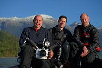 GEO-Photographer Solvin Zankl (left) and GEO-Editor Lars Abromeit (centre) with Dive Assistent Tom Arpe (right), Comau Fjord, Patagonia, Chile