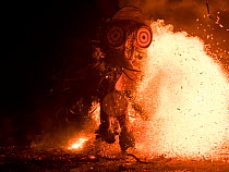 Baining men in traditional fire dance ceremony. Men enter a trance like state and dance around the fire in animal masks to contact the spirit world. Papua New Guinea, March 2017.