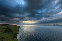 Receding storm over white cliffs of Dover with cross-channel ferry. Kent, UK. July
