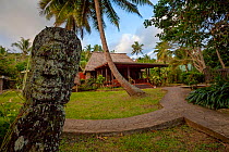 Fijian carving and the view of the dining area at Matava Resort, Kadavu, Fiji.