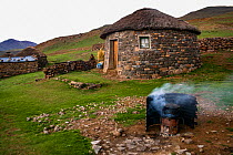 Traditional homestead  with a stone hut and wood-fired stove. Lesotho, southern Africa,