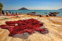Fishing nets lie spread on the beach at Cape Maclear, Lake Malawi, Malawi.