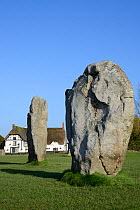 Neolithic megaliths and Red Lion Pub, Avebury Stone Circle, Wiltshire, UK, February 2014.