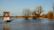 Severely flooded and closed road on Curry Moor between North Curry and East Lyng after weeks of heavy rain, Somerset Levels, UK, February 2014.