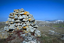 Stone cairn in upland landscape, Causse Mejean,  Cevennes National Park, France, March.
