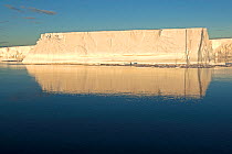 Tabular iceberg on a calm sea, Antarctic Peninsula, Antarctic Sound, Antarctica. December 2015.