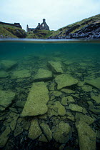 Split level view of  flooded slate quarry on Belnahua island. Scotland. 1996