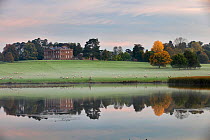 Berrington Hall reflected in lake at dawn, Herefordshire, England, UK, October 2015.