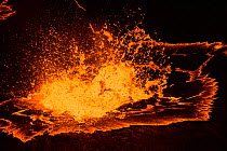 Molten lava boiling in a lava lake in a pit below the crater floor of Halemaumau Crater, Kilauea Volcano, Hawaii. May 2015.
