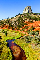 Devils Tower with the Red Beds and Belle Fourche River in Devils Tower National Monument, Wyoming, USA, September 2016.
