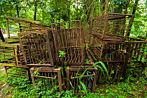 Disused, rusty cages used for Moon bears (Ursus thibetanus) from a bear bile farm. Bile is extracted from the bears' livers to be used in traditional Chinese medicine, China. September 2011.