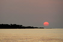 Sunset over Atlantic Ocean, Orango Islands National Park, Bijagos UNESCO Biosphere Reserve, Guinea Bissau, February 2015.